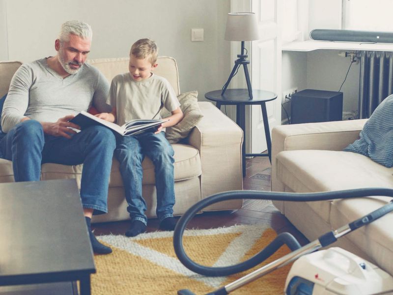 Family remortgaging home and relaxing in living room